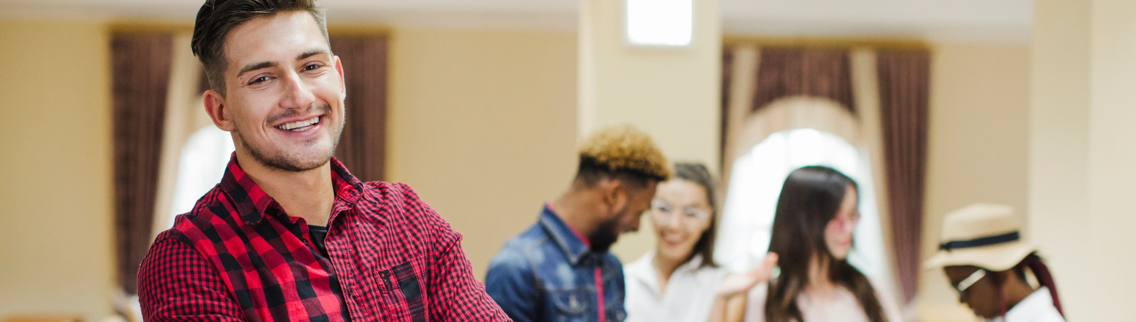 1765800771737-HERO-confident-man-posing-classroom.jpg
