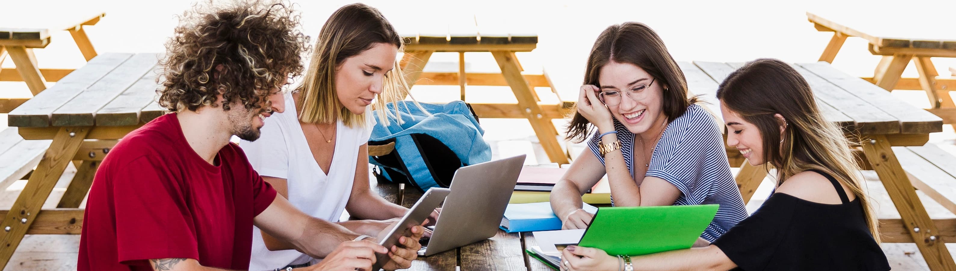 1764852567327-HERO-cheerful-friends-studying-table.jpg