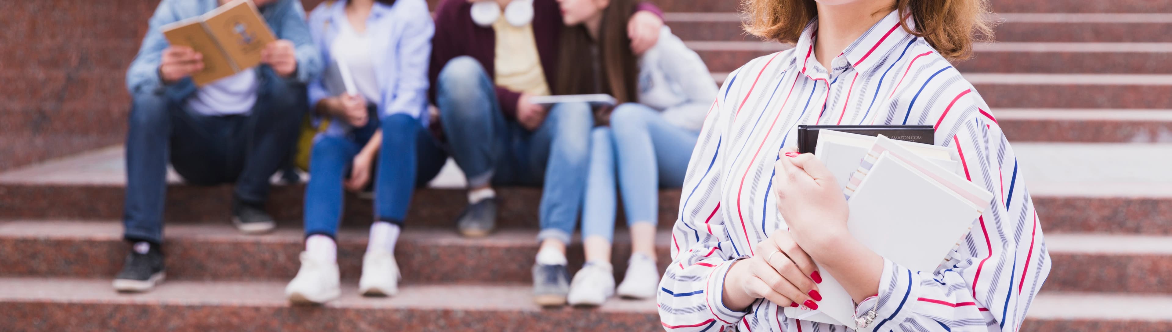 1765800482469-HERO-teenage-girl-standing-holding-notebook-hands.jpg