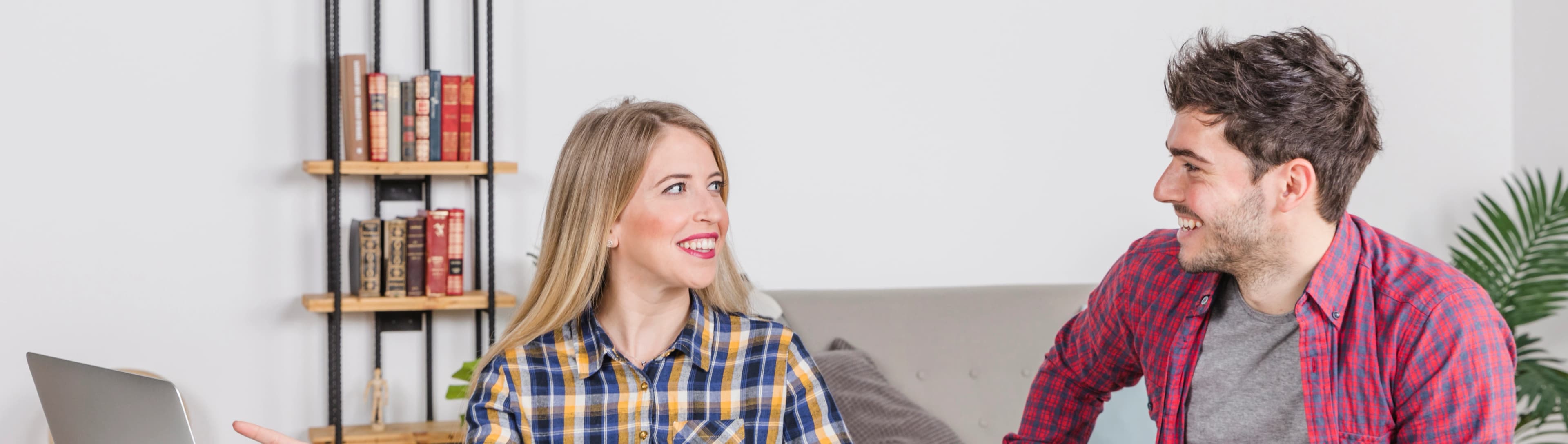 1779784624556-HERO-happy-parents-with-baby-pointing-laptop-screen.jpg